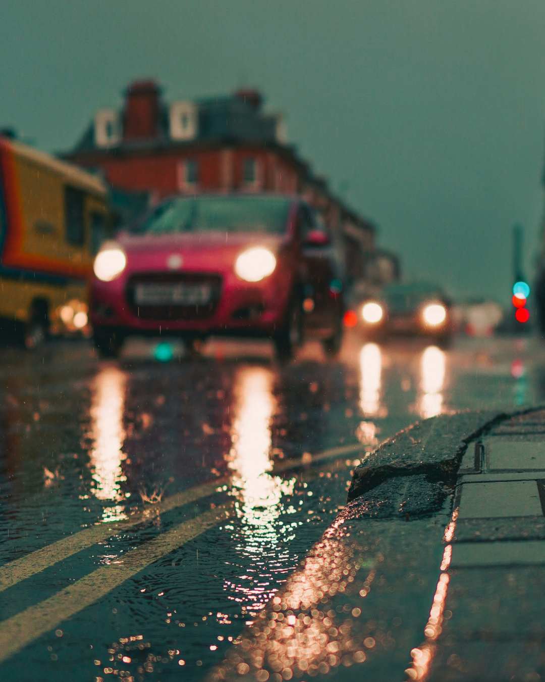 Wet-Road-car-jack-lucas-smith-WcI3JA0gQ1w-unsplash (1) Photo of a car driving down a wet road by Jack Lucas Smith on Unsplash